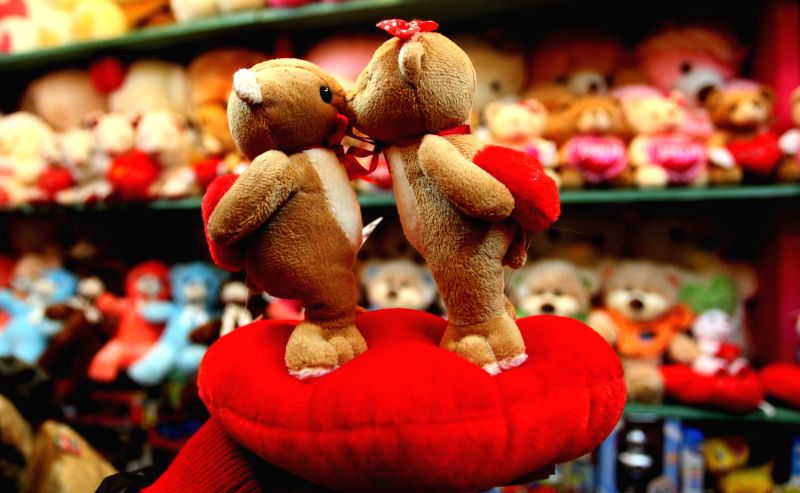 A lady selects a gift for the upcoming Valentine's Day in a gift shop in Kathmandu, Nepal, Feb. 12, 2014. Valentine's day is celebrated worldwide on ...