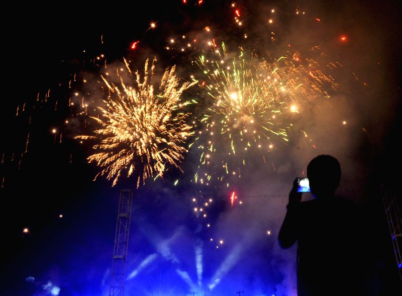 People celebrate Diwali with fireworks at Salt Lake in Kolkata, on Oct. 23, 2014.