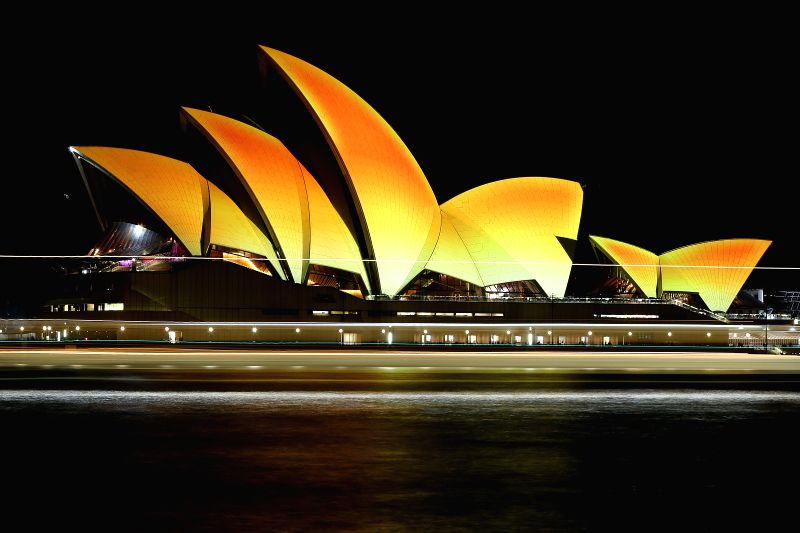 SYDNEY, Oct. 21, 2016 - Photo taken on Oct. 21, 2016 shows the Sydney Opera House is illuminated gold to celebrate Diwali, the Hindu festival of lights in Sydney, Australia. The iconic sails of the ...